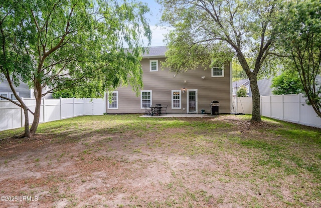 31 Shadow Moss Dr, Beaufort, SC 29906 - back of property with a patio area, a fenced backyard, and a lawn