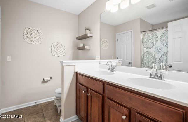 31 Shadow Moss Dr, Beaufort, SC 29906 - bathroom featuring tile patterned flooring, double vanity, a sink, and toilet