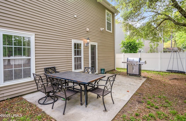 31 Shadow Moss Dr, Beaufort, SC 29906 - view of patio with outdoor dining area, a grill, and fence