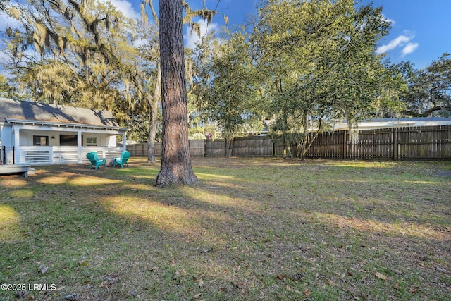 view of yard with a fenced backyard