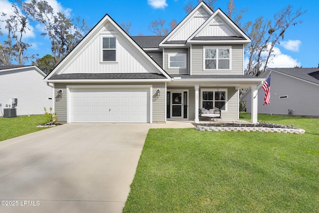 view of front of property featuring board and batten siding, a front lawn, concrete driveway, covered porch, and central AC unit