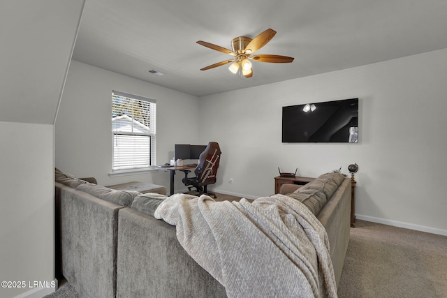 living room with visible vents, carpet floors, baseboards, and ceiling fan