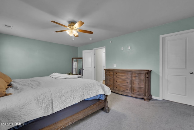 bedroom featuring visible vents, carpet flooring, baseboards, and ceiling fan