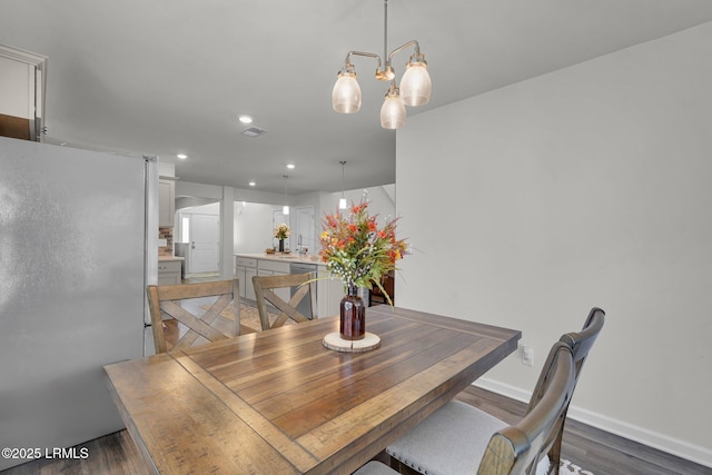 dining area featuring recessed lighting, visible vents, baseboards, and wood finished floors