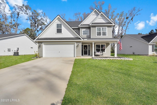 view of front of home with driveway, a porch, an attached garage, a front lawn, and board and batten siding