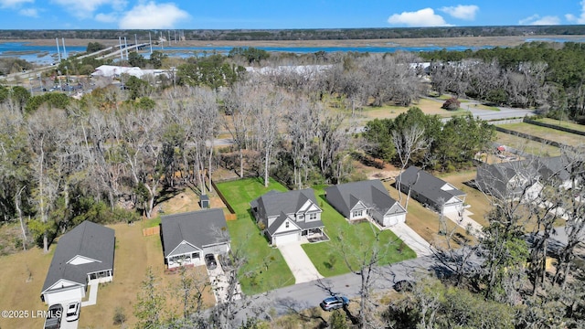 bird's eye view with a forest view and a residential view