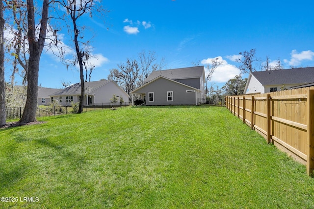 view of yard with a fenced backyard