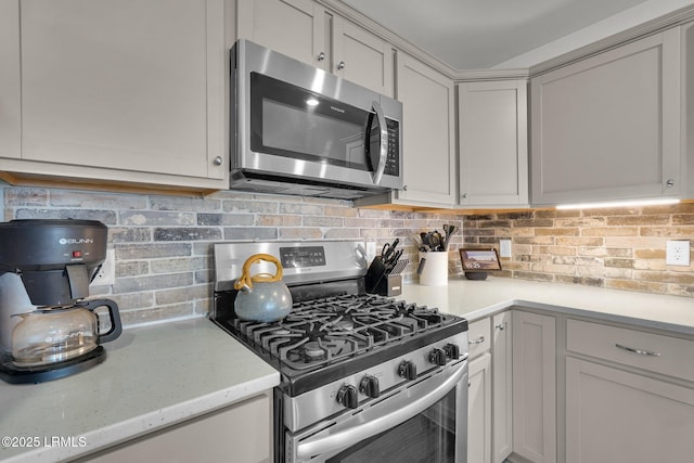 kitchen featuring backsplash and appliances with stainless steel finishes