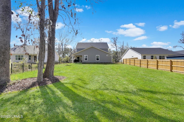 view of yard featuring a fenced backyard