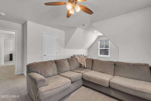 living room featuring visible vents, baseboards, lofted ceiling, light colored carpet, and ceiling fan