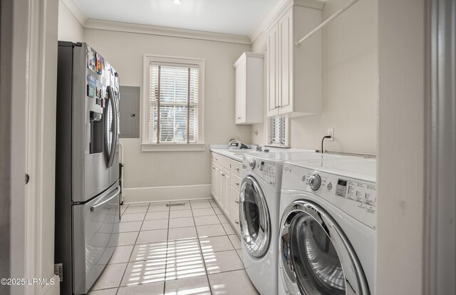 clothes washing area featuring cabinets, crown molding, light tile patterned floors, and independent washer and dryer