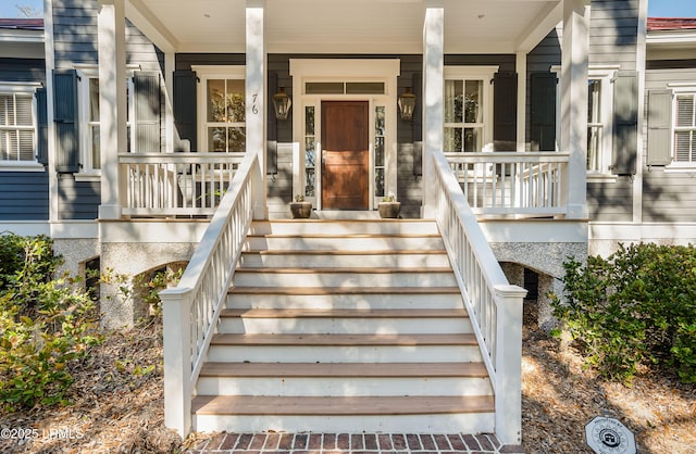 property entrance with covered porch