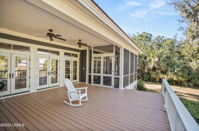 deck with a sunroom, ceiling fan, and french doors