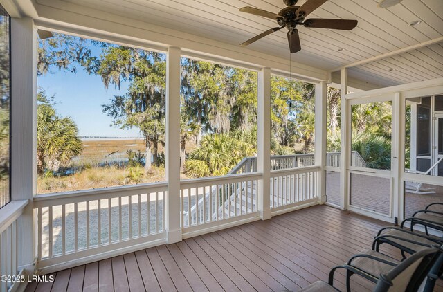 sunroom / solarium featuring ceiling fan