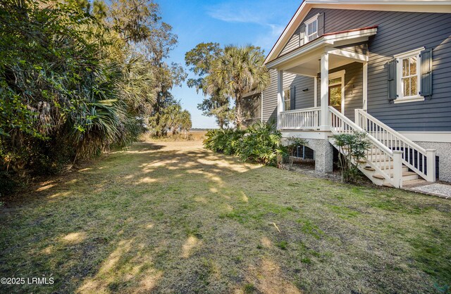 view of yard featuring a porch