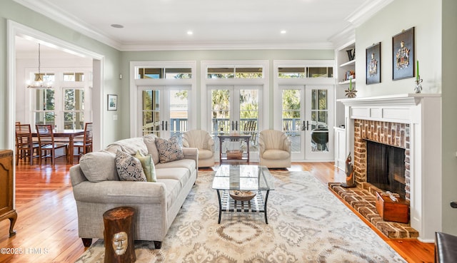 sunroom / solarium featuring a fireplace, french doors, and a chandelier