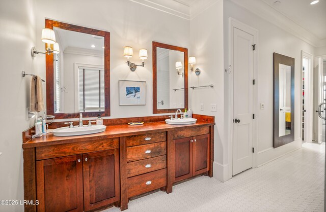 bathroom with vanity and ornamental molding