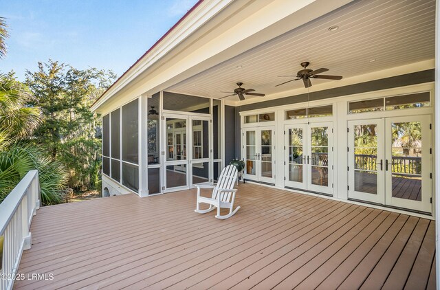 deck with a sunroom, ceiling fan, and french doors