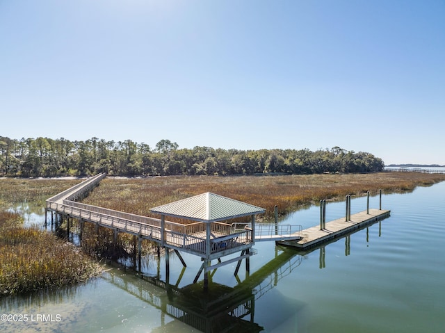 view of dock featuring a gazebo and a water view