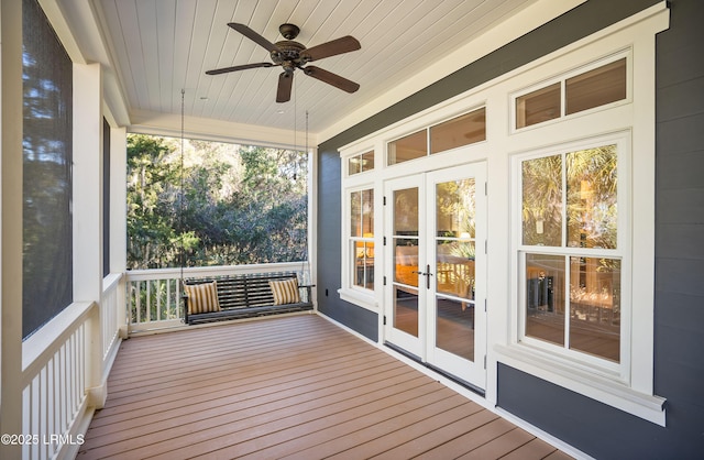 unfurnished sunroom with wooden ceiling, ceiling fan, and french doors