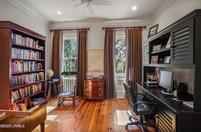 office area with ornamental molding, light hardwood / wood-style floors, and ceiling fan