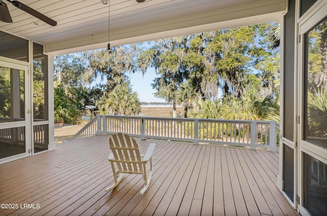 wooden deck featuring ceiling fan