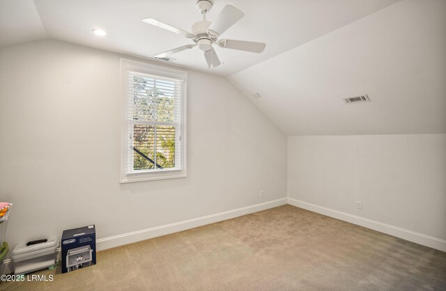 additional living space with lofted ceiling, carpet floors, and ceiling fan