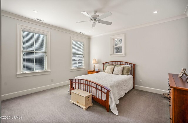 bedroom featuring light carpet, crown molding, and ceiling fan