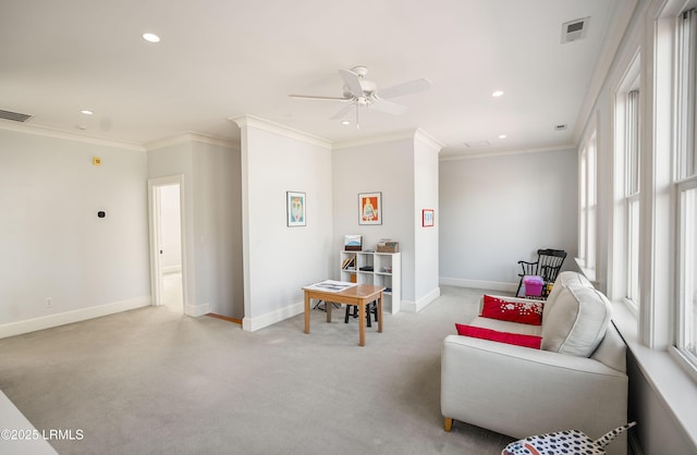 living room featuring ornamental molding, light carpet, and a wealth of natural light