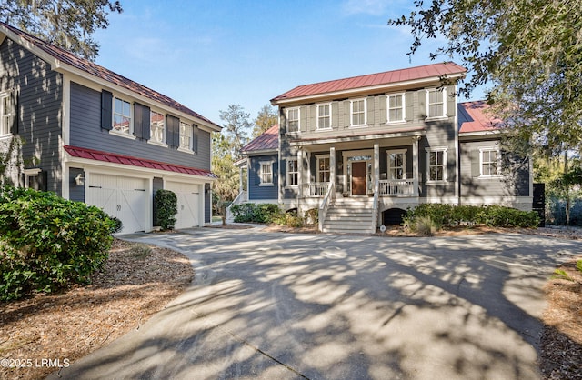 view of front of property featuring a garage and covered porch