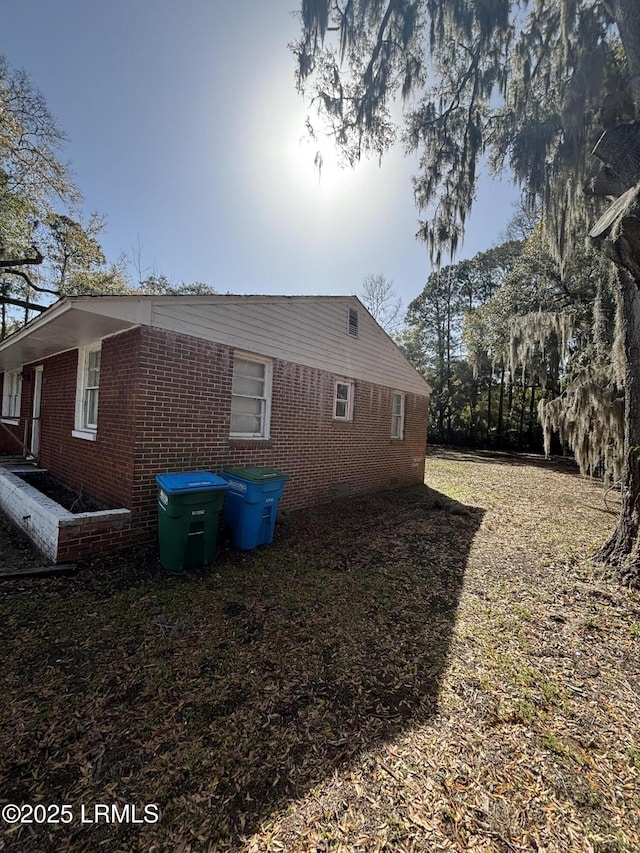 view of home's exterior featuring brick siding