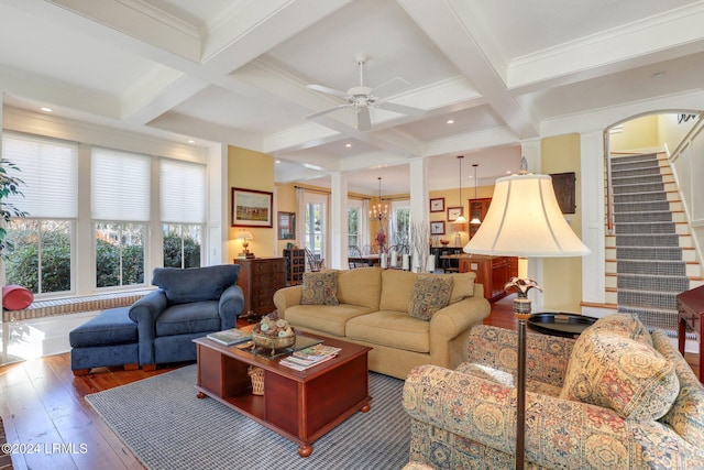 living room featuring coffered ceiling, beam ceiling, and hardwood / wood-style floors