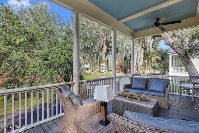 wooden deck with ceiling fan and an outdoor hangout area