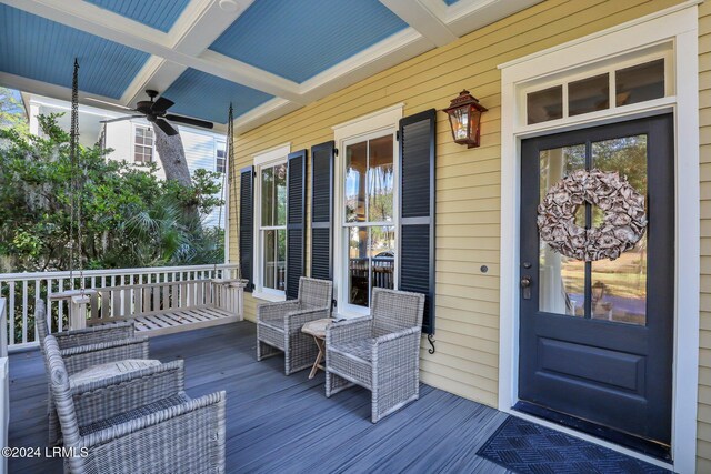 wooden deck with ceiling fan and a porch