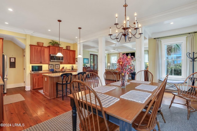 dining area with crown molding, decorative columns, and dark hardwood / wood-style floors