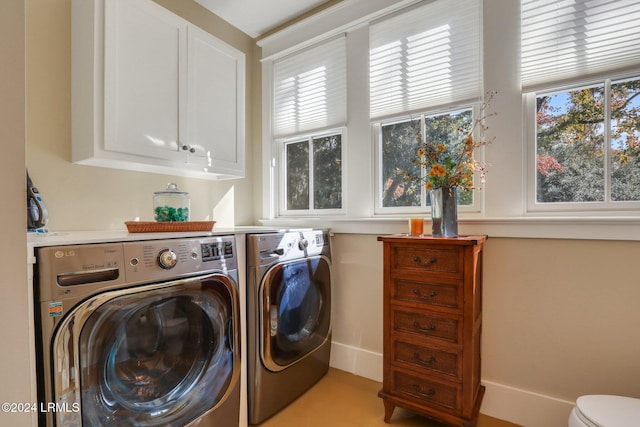 laundry room featuring plenty of natural light and separate washer and dryer