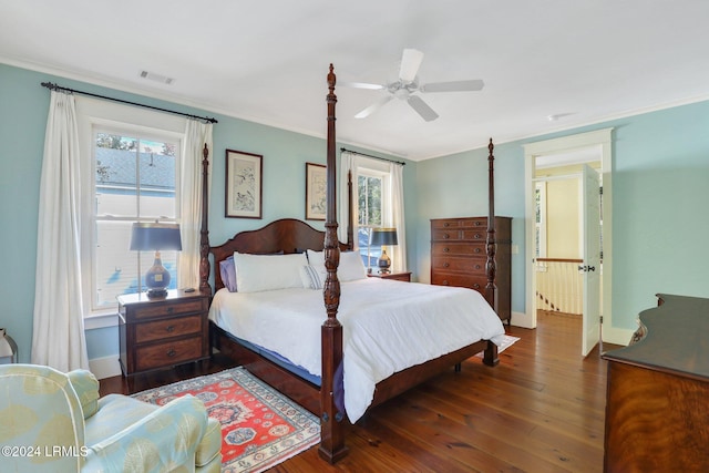 bedroom with multiple windows, ornamental molding, dark hardwood / wood-style floors, and ceiling fan