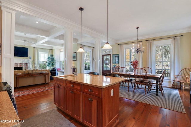 kitchen featuring coffered ceiling, light stone countertops, beam ceiling, and hanging light fixtures