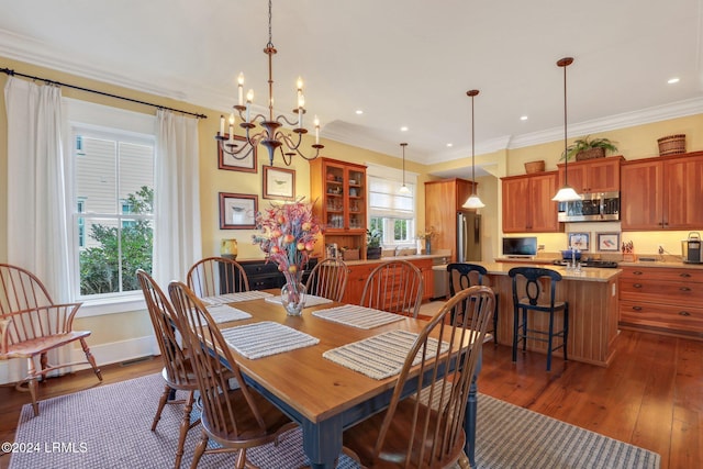 dining area featuring dark hardwood / wood-style flooring and crown molding