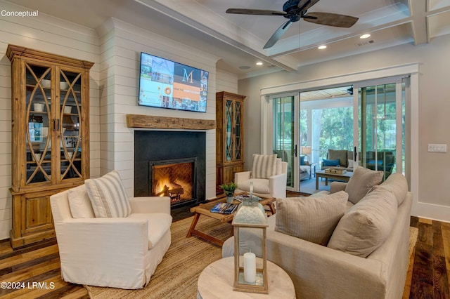 living room featuring beamed ceiling, hardwood / wood-style floors, and ceiling fan