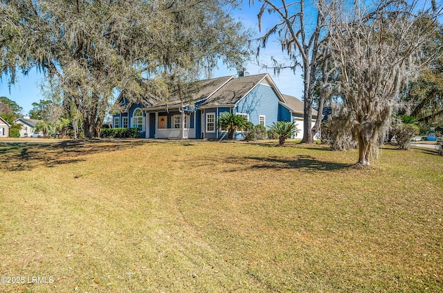 ranch-style home featuring a garage and a front lawn