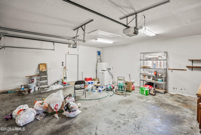 garage featuring a garage door opener and fridge