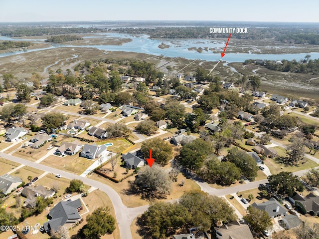 bird's eye view featuring a water view and a residential view