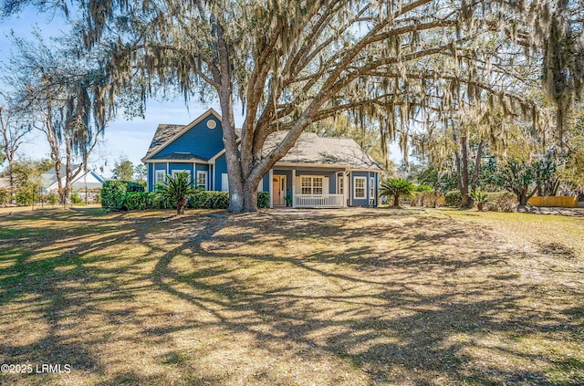 view of front of home featuring a porch and a front yard