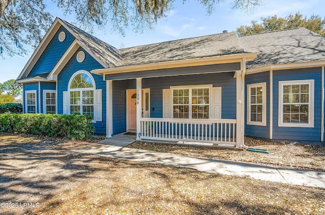 view of front of house featuring a porch and a shingled roof