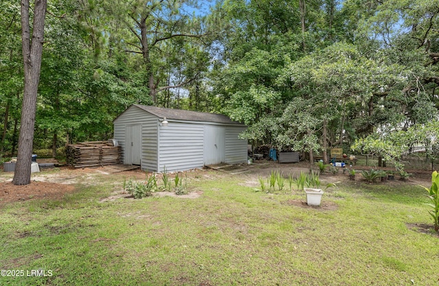 view of yard featuring an outbuilding and a shed