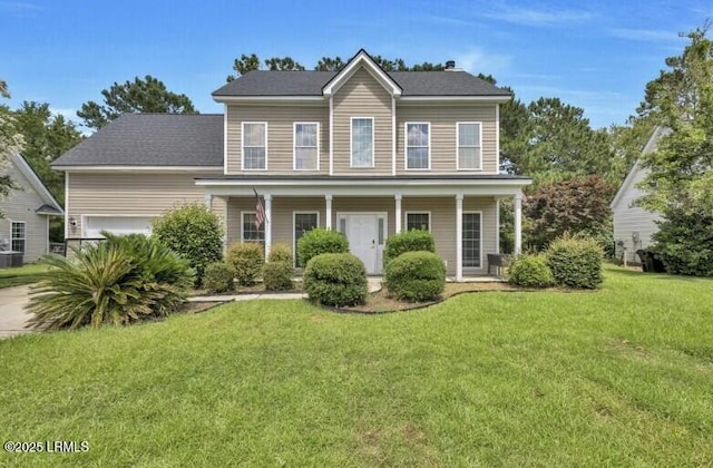 23 Parrot Creek Dr, Okatie, SC 29909 - colonial home featuring a front yard, covered porch, and an attached garage