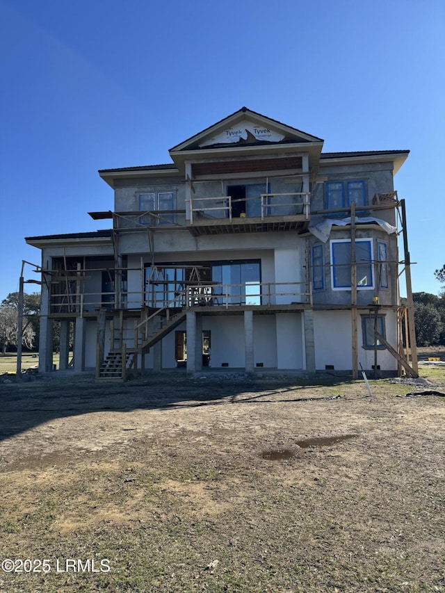 view of front of property featuring stairs