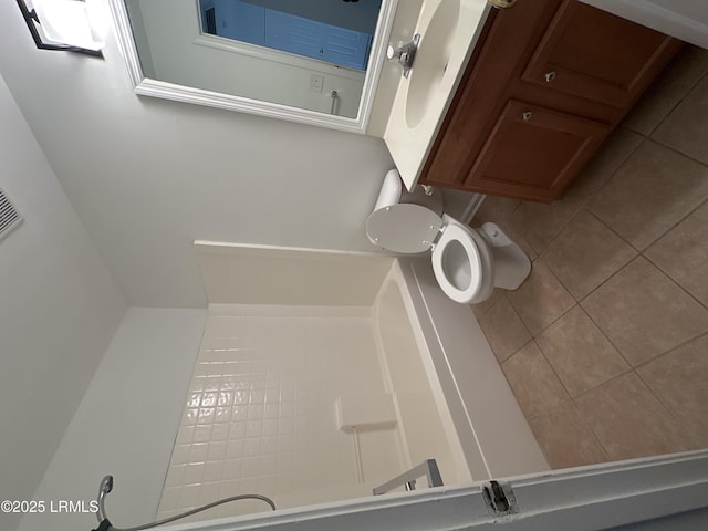 bathroom featuring tile patterned floors and toilet