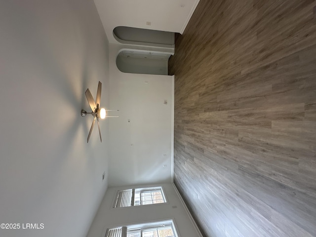 unfurnished room with a towering ceiling